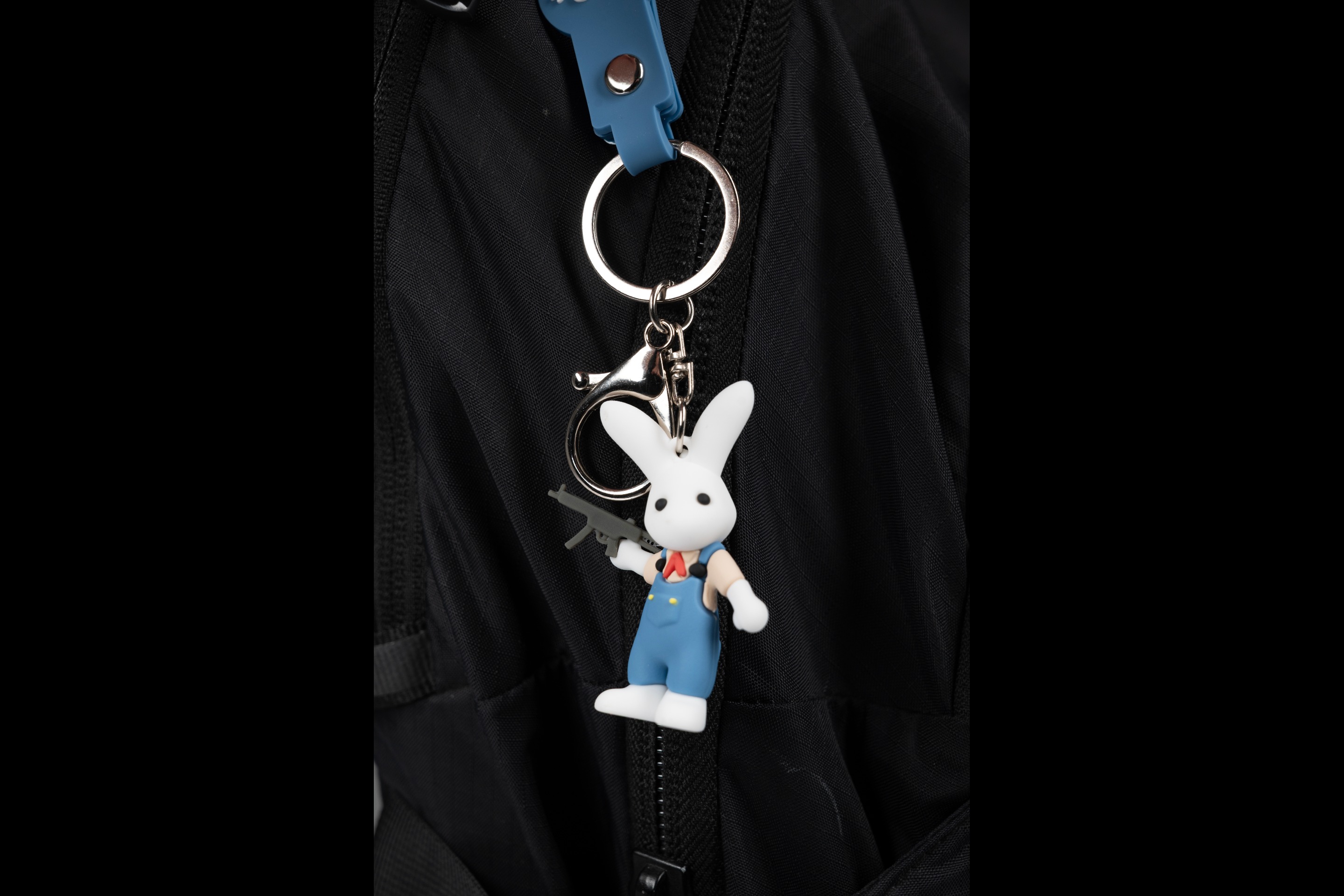 Marlowe Keychain clipped to a backpack